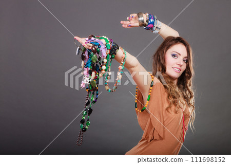 Pretty woman with jewelry necklaces ring bracelets 111698152