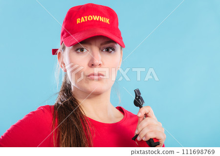 Lifeguard woman in cap on duty with whistle. 111698769