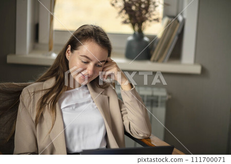 businesswoman using her laptop in office. Small business entrepreneur. 111700071