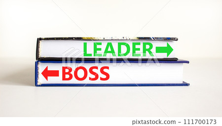 Leader or boss symbol. Concept word Leader or Boss on beautiful books. Beautiful white table white background. Business and leader or boss concept. Copy space. Leader or boss symbol. Concept word Leader or Boss on beautiful books. Beautiful white table white background. Business and leader or boss concept. Copy space. 111700173