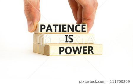 Patience is power symbol. Concept words Patience is power on beautiful wooden blocks. Beautiful white table white background. Businessman hand. Business and patience is power concept. Copy space. Patience is power symbol. Concept words Patience is power on beautiful wooden blocks. Beautiful white table white background. Businessman hand. Business and patience is power concept. Copy space. 111700209