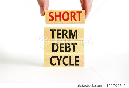 Short term debt cycle symbol. Concept words Short term debt cycle on beautiful wooden block. Beautiful white table background. Businessman hand. Business Short term debt cycle concept. Copy space. 111700241