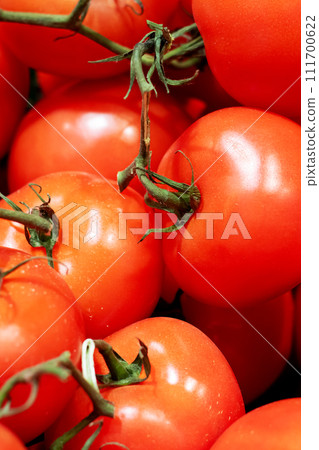 Bright red tomatoes close-up, background or texture Bright red tomatoes close-up, background or texture 111700622