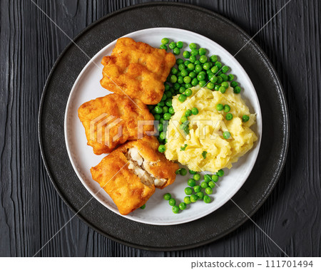fried fish with mashed potatoes and green peas fried fish with mashed potatoes and green peas 111701494