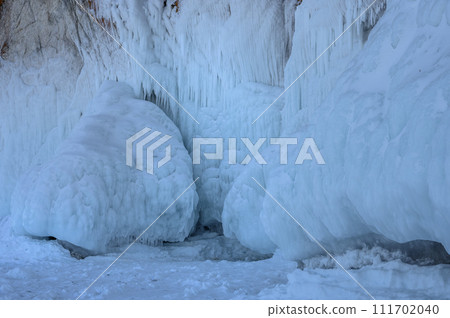 Cape Three Brothers. Beautiful winter landscape of frozen Baikal Lake. 111702040