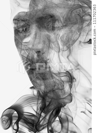A double exposure male portrait combined with a smoke swirl texture 111702363