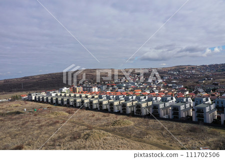 European urban suburban cityscape, aerial view of residential houses and yards European urban suburban cityscape, aerial view of residential houses and yards 111702506