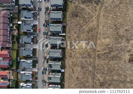 Aerial view of European real estate neighborhood, residential area surrounded by meadow. Housing subdivision, development, sale, investment 111702511
