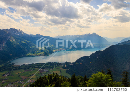 Breathtaking aerial view of Lake Thun and Swiss Alps from Harder Kulm viewpoint, Switzerland Breathtaking aerial view of Lake Thun and Swiss Alps from Harder Kulm viewpoint, Switzerland 111702760