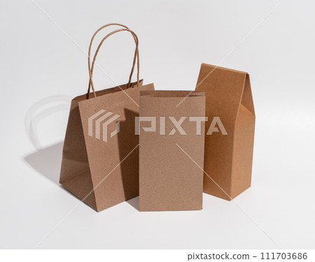 Kraft paper bag, pouches, sacks, box. Brown eco package Kraft paper bag, pouches, sacks, box. Brown eco package 111703686