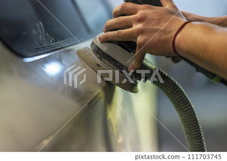 Bulgarian mechanic working in auto shop. 111703745