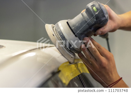 Bulgarian mechanic working in auto shop. 111703748