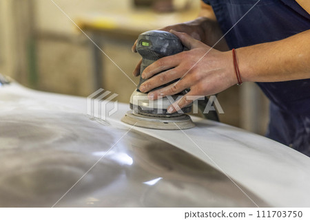 Bulgarian mechanic working in auto shop. Bulgarian mechanic working in auto shop. 111703750