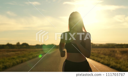 silhouette sports girl running along road sunset, summer thailand, healthy lifestyle, cardio wellness, athletics fitness, athlete exercise sunrise, woman running treadmill. healthy woman running 111703787