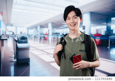 A young man traveling abroad alone 111703840
