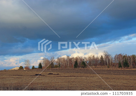 Landscape with dark clouds above the land. thunderclouds 111703935