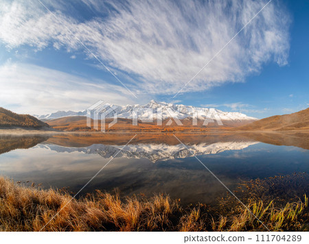 Beautiful autumn mountain lake and mountains. 111704289