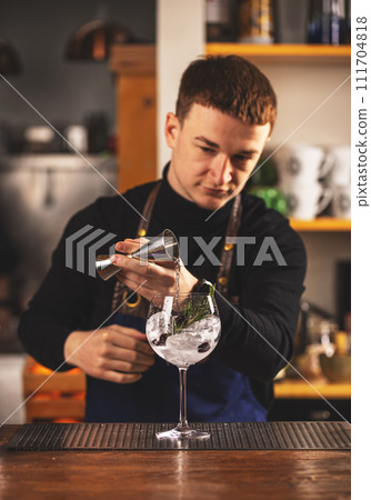 Barman making an alcoholic drink Barman making an alcoholic drink 111704818