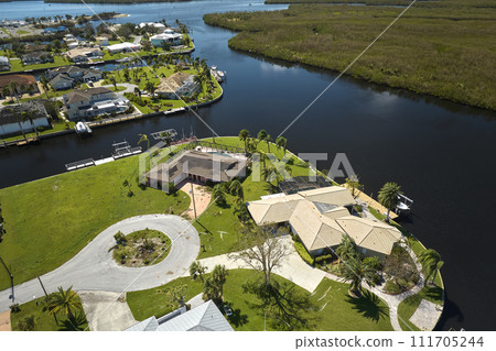 Severely damaged by hurricane Ian seaside houses in Florida home residential area. Consequences of natural disaster Severely damaged by hurricane Ian seaside houses in Florida home residential area. Consequences of natural disaster 111705244
