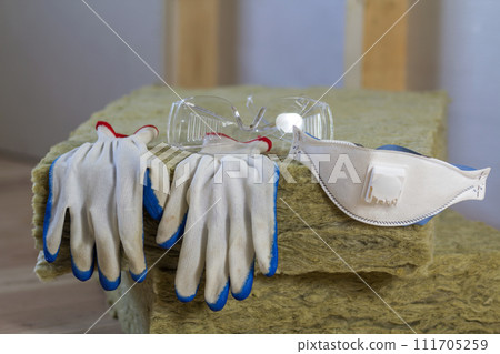 Rock wool and fiberglass insulation staff material for cold barrier. Tools for work with glass wool 111705259