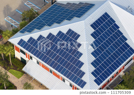 Photovoltaic panels on solar rooftop of Florida commercial building for producing clean ecological electrical energy. Renewable electricity with zero emission concept Photovoltaic panels on solar rooftop of Florida commercial building for producing clean ecological electrical energy. Renewable electricity with zero emission concept 111705309