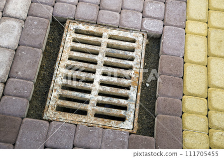 Installation of stone paving slabs in a yard. Installation of stone paving slabs in a yard. 111705455