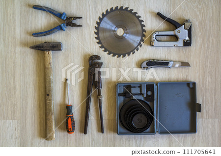 Construction, building and repair tools set for house work on wooden background. Top view. 111705641