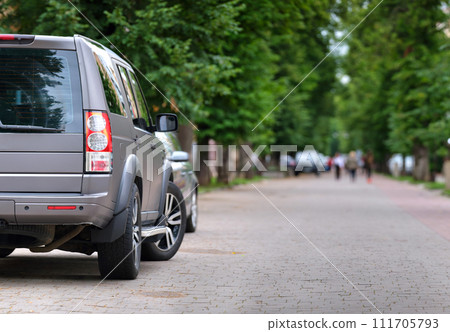 Close up of a car parked illegally against traffic rules on pedestrian city street side. Close up of a car parked illegally against traffic rules on pedestrian city street side. 111705793