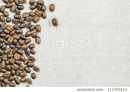 Burlap Sackcloth Canvas and Coffee Beans Photo Background. Copy Space. Coffee Border Burlap Sackcloth Canvas and Coffee Beans Photo Background. Copy Space. Coffee Border 111705813