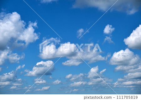 Bright landscape of white puffy cumulus clouds on blue clear sky. 111705819