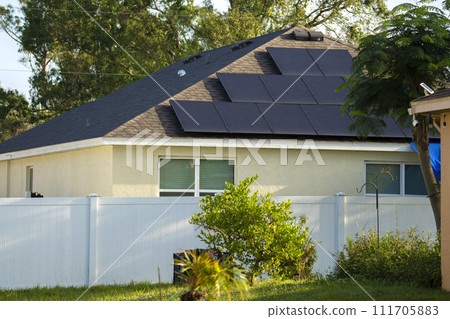 Aerial view of typical american building roof with rows of blue solar photovoltaic panels for producing clean ecological electric energy. Renewable electricity with zero emission concept 111705883