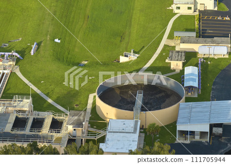 Aerial view of modern water cleaning facility at urban wastewater treatment plant. Purification process of removing undesirable chemicals, suspended solids and gases from contaminated liquid 111705944