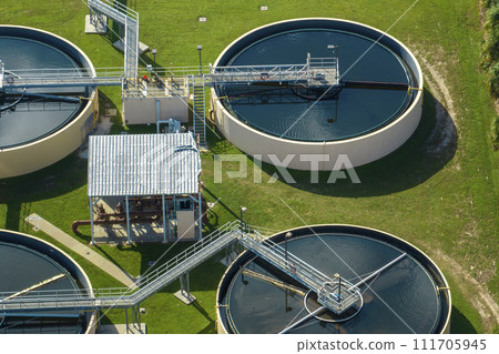 Aerial view of modern water cleaning facility at urban wastewater treatment plant. Purification process of removing undesirable chemicals, suspended solids and gases from contaminated liquid 111705945