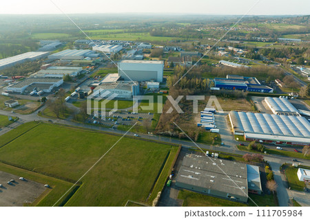Aerial view of goods warehouses and logistics center in industrial city zone from above 111705984