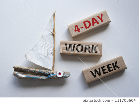 4-day work week symbol. Concept words 4-day work week on wooden blocks. Beautiful white background with boat. Business and 4-day work week concept. Copy space 4-day work week symbol. Concept words 4-day work week on wooden blocks. Beautiful white background with boat. Business and 4-day work week concept. Copy space 111706604