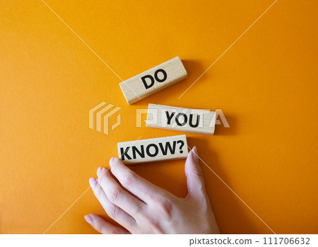 Do you know symbol. Concept word Do you know on wooden cubes. Businessman hand. Beautiful orange background. Business and Do you know concept. Copy space. Do you know symbol. Concept word Do you know on wooden cubes. Businessman hand. Beautiful orange background. Business and Do you know concept. Copy space. 111706632