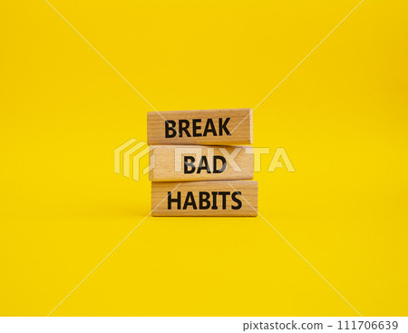 Break bad habits symbol. Concept words Break bad habits on wooden blocks. Beautiful yellow background. Medicine and Break bad habits concept. Copy space. 111706639