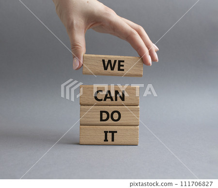 We can do it symbol. Concept words We can do it on wooden blocks. Beautiful grey background. Businessman hand. Business and We can do it concept. Copy space. We can do it symbol. Concept words We can do it on wooden blocks. Beautiful grey background. Businessman hand. Business and We can do it concept. Copy space. 111706827