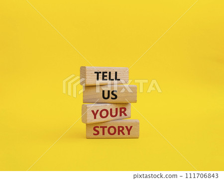 Tell us your story symbol. Concept words Tell us your story on wooden blocks. Beautiful yellow background. Business and Tell us your story concept. Copy space. Tell us your story symbol. Concept words Tell us your story on wooden blocks. Beautiful yellow background. Business and Tell us your story concept. Copy space. 111706843
