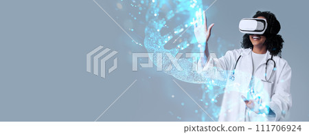 Excited black woman doctor in VR glasses touching DNA chain 111706924