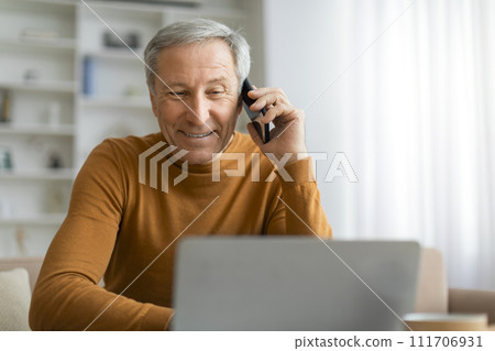 Closeup of senior businessman have phone conversation 111706931
