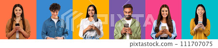 Diverse group of six young adults smiling and using smartphones, dressed Diverse group of six young adults smiling and using smartphones, dressed 111707075
