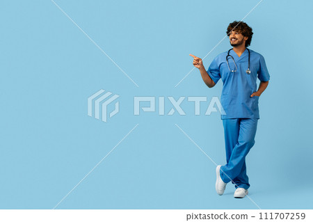 Doctor in medical uniform point finger on copy space Doctor in medical uniform point finger on copy space 111707259