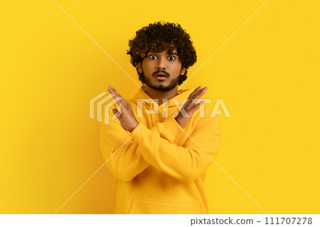 Shocked indian millennial guy in casual saying no 111707278
