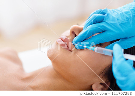 The doctor does injections to correct lip line The doctor does injections to correct lip line 111707298