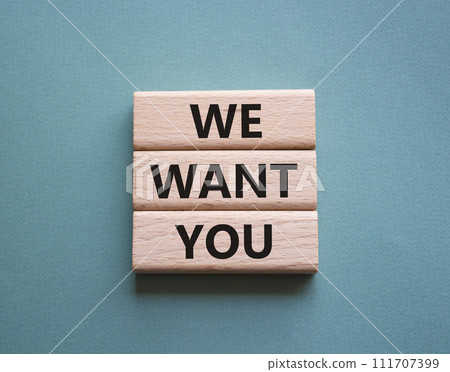 We want you symbol. Concept words We want you on wooden blocks. Beautiful grey green background. Business and We want you concept. Copy space. 111707399