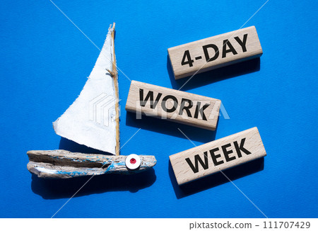 4-day work week symbol. Concept words 4-day work week on wooden blocks. Beautiful blue background with boat. Business and 4-day work week concept. Copy space 111707429
