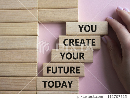 Future and development symbol. Wooden blocks with words You Create your Future today. Businessman hand. Beautiful pink background. Business and Future and development concept. Copy space. 111707515