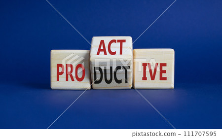 Proactive and Productive symbol. Wooden cubes with words Productive and Proactive. Beautiful deep blue background. Business concept. Copy space Proactive and Productive symbol. Wooden cubes with words Productive and Proactive. Beautiful deep blue background. Business concept. Copy space 111707595