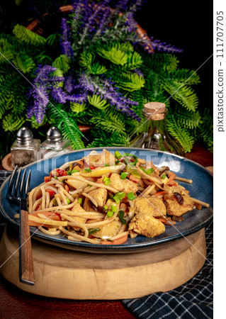 Fried noodles with chicken and vegetables. 111707705